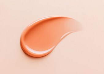 Orange carrot color lip gloss swatch on pastel background. Close-up of liquid lipstick, glossy cosmetics texture, horizontal flatlay. Professional studio light