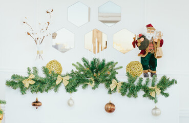 Holiday background. Christmas decorations in white interior. Close up. Light Christmas wallpaper.