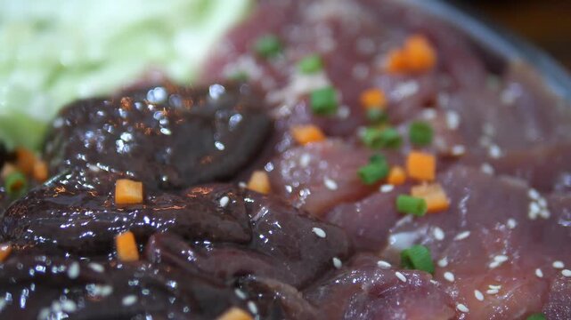 Raw mixed pork slices with liver and vegetables prepared for Thai hot pot (Jim Jum)