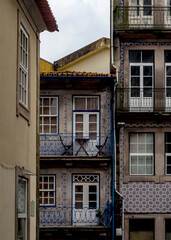 A view of the facade of a building with windows and balconies.