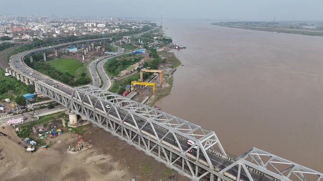 Evening view of Patna Marine Drive with JP Ganga Setu stretching across the Ganges in Bihar, India. A blend of modern infrastructure and riverside beauty, capturing city life, skyline, and tranquil wa