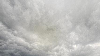 Dark, heavy gray cloud background with clear copy space for text and graphics.