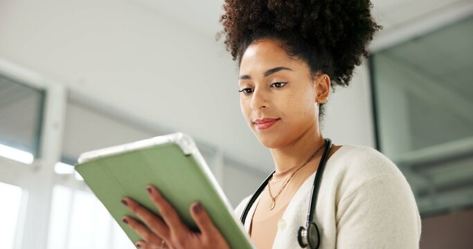 Medical, reading or black woman in clinic with tablet, research or review of patient records. Healthcare, evaluation and doctor in hospital with tech, e health results or checklist for treatment plan