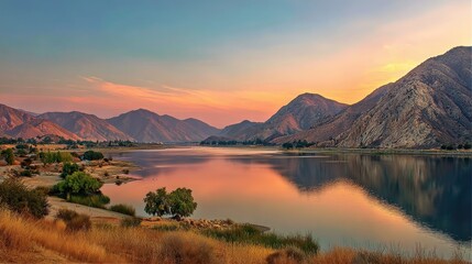 Obraz premium Breathtaking Sunset Over Lake Isabella, California: A Serene Idyll Amidst Majestic Mountains