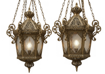 Two ornate antique brass hanging lanterns isolated on transparent background