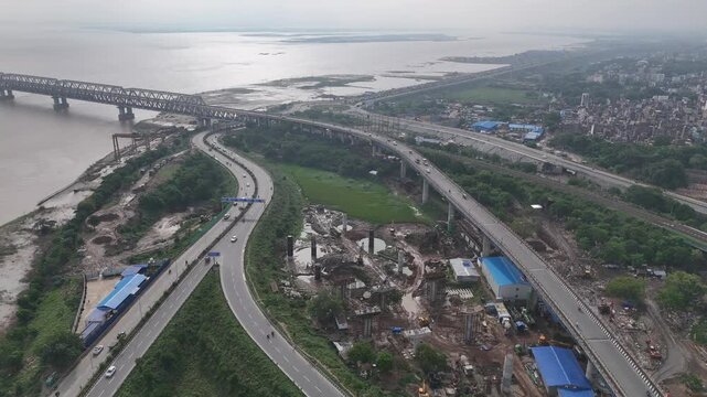 Evening view of Patna Marine Drive with JP Ganga Setu stretching across the Ganges in Bihar, India. A blend of modern infrastructure and riverside beauty, capturing city life, skyline, and tranquil wa