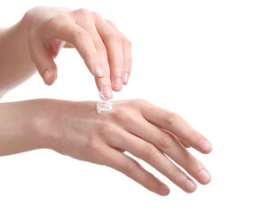 Female hands applying cosmetic cream on white background