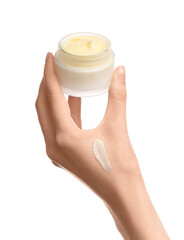 Female hand with jar of cosmetic cream on white background