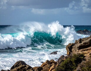 Powerful ocean waves crashing against rocky shore showing natural energy and force