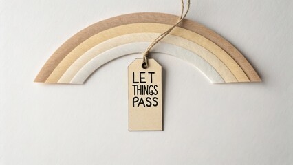 Decorative rainbow made of pastel paper with motivational tag, emphasizing relaxation and mindfulness through simple design