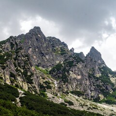 Rocky mountain ridge under cloudy sky showing dramatic natural wilderness