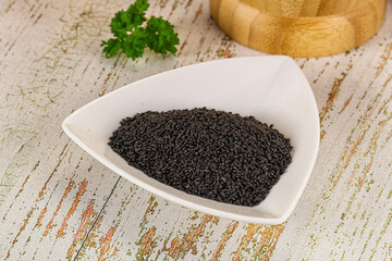 Black dry Nigella seeds in the bowl