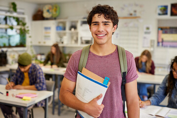 Smiling latin student in classroom during lesson © Rido