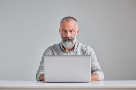 Professional Business Tech Environment Documentary Style Photo of Man Working in Office Space