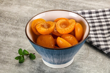 Sweet canned apricots with syrope