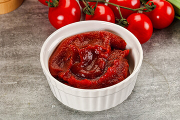 Red tomato paste in the bowl