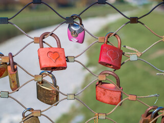 Red heart padlocks on Makartsteg bridge over the Salzach in Salzburg, Austria