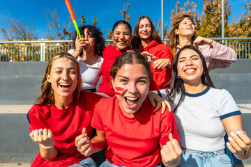 Group of young women cheering a sports team