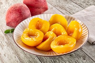 Sweet ripe yellow canned peaches