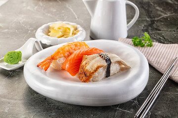Japanese cuisine - sushi with eel, salmon and prawn