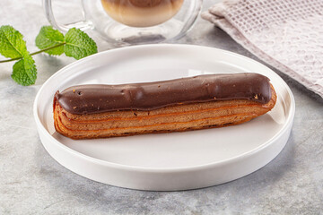 Gourmet chocolate eclair with icing