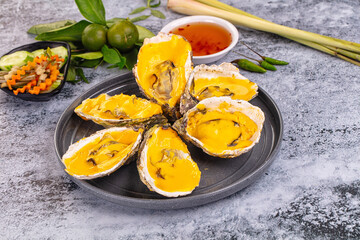 Baked oyster with cheddar cheese