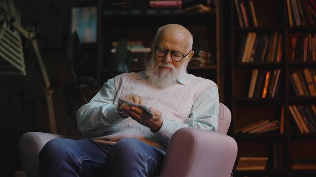 Upset senior man counting last money in his palm, low pension and poverty