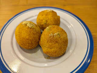 Traditional Qatari Dessert Luqaimat (Sweet Fried Dumplings) with Date Syrup