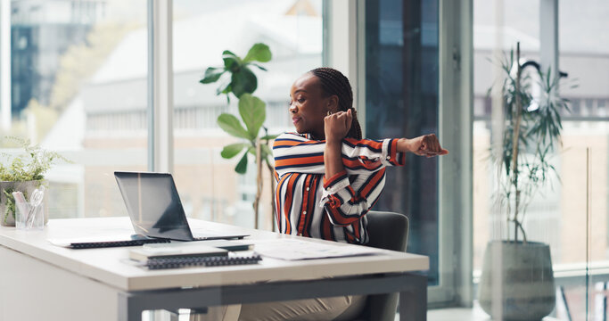 Laptop, business woman and stretching in office to start work, productivity and budget review. Finance manager, black person and online tutorial at desk for muscle relief, posture or financial report