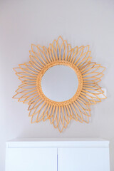 Decorative rattan mirror on the wall