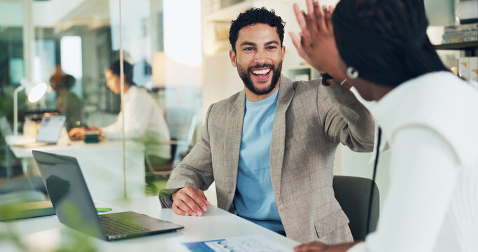 Business, laptop and team high five with paperwork for investment return, KPI performance and success. Financial analyst, happy people and celebration in office for risk mitigation or positive budget