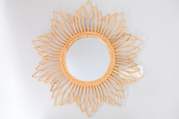 Decorative rattan mirror on the wall
