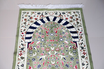 Muslim prayer mat on the floor