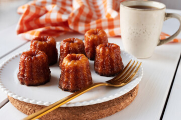 Local French dessert canele served on a plate