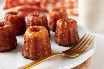 Local French dessert canele served on a plate