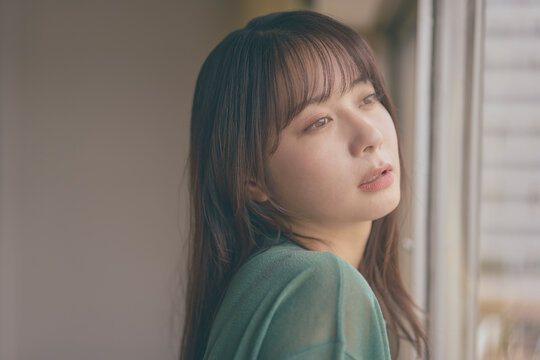 A Japanese woman in her twenties with long hair.