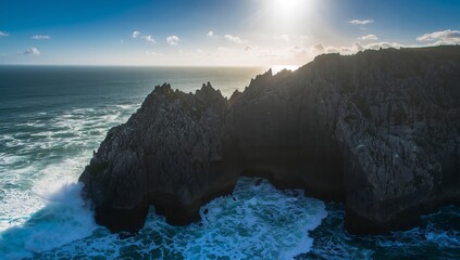 Rocky Coastal Landscape Dramatic Sky and Ocean Waves, Seashore Cliff Formation.
