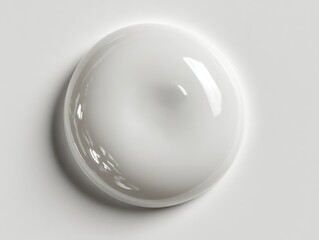 one big single round drop of a transperent liquid isolated on white