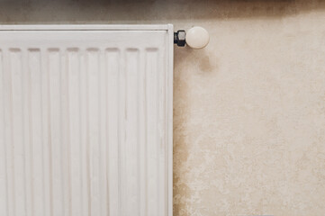 A heating battery with a regulator for controlling the temperature in the house during the cold season. Savings on utilities and heating. Reasonable consumption of heat and gas.