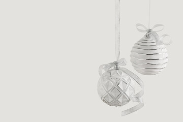 Christmas balls hanging on white background