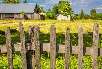 Fototapeta premium Wooden fence in rural area of Mazowsze region in Poland