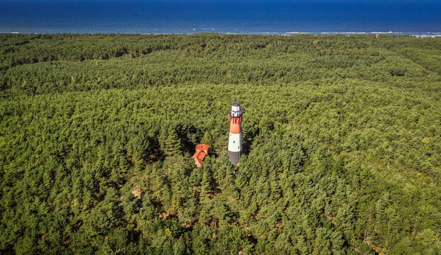 Drone view of Baltic Sea lighthouse called Stilo in Osetnik settlement near Sasino village, Poland
