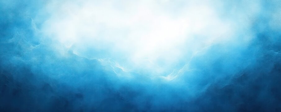 Bright light shining through thick, fluffy blue and white clouds creating a serene and uplifting atmosphere