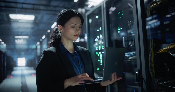 Technician checks server equipment using laptop in data center, software analysis, internet connectivity, technical service support for stable system performance and cyber security.