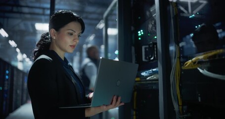 Network engineer checks and monitors server racks using a laptop in data center, activating network devices, checks system performance, cyber security data safety, technical service support. - Powered by Adobe