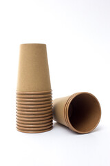 Several stacks of brown paper coffee cups isolated on white background. These cups are eco- friendly, suitable for coffee businesses in cafes.