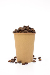 A paper coffee cup and coffee beans, isolated on white background.