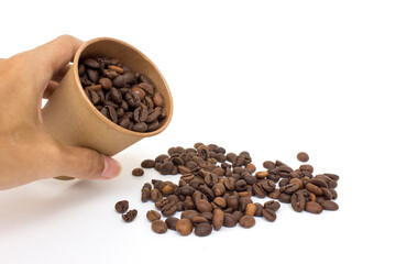 A paper coffee cup and coffee beans, isolated on white background.