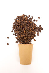A paper coffee cup and coffee beans, isolated on white background.
