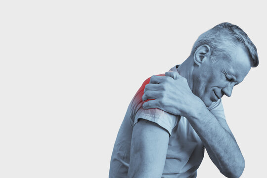 Sad man suffering from shoulder pain, pressing hand to sore spot. Man holding shoulder blade, red spot indicates myofascial pain, black and white illustration
